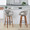 Curvo bar stool in Walnut Wood, Light Grey PU, Black Metal, featuring swivel and wood frame