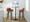 Daniella 30" Contemporary Fixed-Height Barstool with Swivel in Walnut Glazed Wood and Camel Faux Leather with Round Black Metal Footrest- Set of 2 — lifestyle photo 3