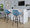 Fabrico 30" Mid-Century Modern Fixed-Height Barstool with Swivel in Walnut Glazed Wood and Blue Noise Fabric with Round Black Metal Footrest- Set of 2 — lifestyle photo 1
