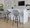Fabrico 30" Mid-Century Modern Fixed-Height Barstool with Swivel in Walnut Glazed Wood and Grey Noise Fabric with Round Black Metal Footrest- Set of 2 — lifestyle photo 1