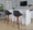 Fabrico 30" Mid-Century Modern Fixed-Height Barstool with Swivel in Walnut Wood and Charcoal Fabric with Round Black Metal Footrest- Set of 2 — lifestyle photo 1