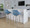 Fabrico 30" Mid-Century Modern Fixed-Height Barstool with Swivel in Light Grey Wood and Blue Noise Fabric with Round Chrome Metal Footrest- Set of 2 — lifestyle photo 1