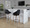 Fabrizzi bar stool in Light Grey Wood, Black PU, Black Metal, featuring swivel and wood frame