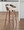 Grotto Mid-Century Modern Barstool in Walnut and Cream Faux Leather- Set of 2 — lifestyle photo 5