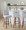 Hank 30" Contemporary Fixed-Height Barstool with Swivel in Walnut Wood and Light Grey Fabric with Round Black Metal Footrest- Set of 2 — lifestyle photo 1