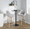 Hannah bar stool in Whitewashed Wood, Grey Fabric, Black Metal, featuring swivel and upholstered seat