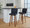 Henry 30" Contemporary Fixed-Height Barstool with Swivel in Walnut Wood and Black Faux Leather with Round Chrome Footrest- Set of 2 — lifestyle photo 1