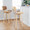 Lombardi 30" Contemporary Fixed-Height Barstool with Swivel in Natural Wood and Camel Faux Leather with Round Chrome Metal Footrest- Set of 2 — lifestyle photo 1