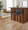 Mason Mara 30" Contemporary Fixed-Height Barstool in Gold Metal, Walnut Wood and Black Faux Leather- Set of 2 — lifestyle photo 1