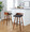 Maya bar stool in Black Metal, Walnut Wood, Charcoal Fabric, featuring swivel and wood frame