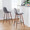 Pebble 30" Contemporary Fixed-Height Barstool in Walnut Metal and Grey Faux Leather with Square Black Metal Footrest- Set of 2 — lifestyle photo 2