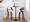 Pino 30" Mid-Century Modern Fixed-Height Barstool with Swivel in Mahogany Wood and White Faux Leather with Round Chrome Metal Footrest- Set of 2 — lifestyle photo 5