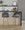 Renee Upholstered 30" Contemporary Fixed-Height Barstool in Gold Metal and Dark Grey Fabric with Square Footrest- Set of 2 — lifestyle photo 1
