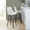 Marcel bar stool in Walnut Glazed Wood, Black Metal, Cream Fabric, Brass Metal, featuring swivel and wood frame