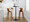 Curvo bar stool in Walnut Wood, Chrome Metal, Cream PU, featuring swivel and wood frame