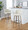 Toriano 30" Contemporary Fixed-Height Barstool with Swivel in Light Grey Wood and Cream Noise Fabric with Round Black Metal Footrest- Set of 2 — lifestyle photo 2