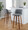 Tintori bar stool in Walnut Wood, Grey Fabric, Chrome Metal, featuring swivel and wood frame