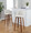 Tintori bar stool in Walnut Wood, Cream Noise Fabric, Chrome Metal, featuring swivel and wood frame