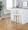 Toriano 30" Contemporary Fixed-Height Barstool with Swivel in Whitewashed Wood and Cream Noise Fabric with Round Chrome Metal Footrest- Set of 2 — lifestyle photo 1
