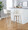 Toriano 30" Contemporary Fixed-Height Barstool with Swivel in Whitewashed Wood and Cream Noise Fabric with Round Chrome Metal Footrest- Set of 2 — lifestyle photo 2