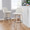 Toriano 30" Contemporary Fixed-Height Barstool with Swivel in Whitewashed Wood and Cream Noise Fabric with Round Black Metal Footrest- Set of 2 — lifestyle photo 2