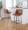 Toriano 30" Contemporary Fixed-Height Barstool with Swivel in Light Grey Wood and Camel Faux Leather with Round Black Metal Footrest- Set of 2 — lifestyle photo 1