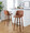 Tintori bar stool in Walnut Wood, Camel PU, Black Metal, featuring swivel and wood frame