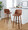 Tintori bar stool in Walnut Wood, Camel PU, Black Metal, featuring swivel and wood frame