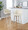 Toriano 30" Contemporary Fixed-Height Barstool with Swivel in Whitewashed Wood and Cream Faux Leather with Round Chrome Metal Footrest- Set of 2 — lifestyle photo 1