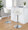 Ahoy Contemporary Adjustable Barstool with Swivel in Chrome Metal and Cream Fabric with Rounded T Footrest- Set of 2 — lifestyle photo 2