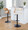 Cecina Contemporary Adjustable Barstool with Swivel in Black Metal, Zebra Wood and Cream Faux Leather with Rounded T Footrest- Set of 2 — lifestyle photo 4