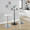 Charlotte Glam Adjustable Barstool with Swivel in Chrome Metal and White Faux Leather with Rounded T Footrest- Set of 2 — lifestyle photo 3