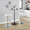 Charlotte Glam Adjustable Barstool with Swivel in Chrome Metal and White Faux Leather with Rounded T Footrest- Set of 2 — lifestyle photo 4