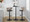 Cosi Mid-Century Modern Adjustable Barstool with Swivel in Black Metal, Light Grey Wood and Black Faux Leather with Rounded T Footrest- Set of 2 — lifestyle photo 1