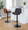 Corazza table in Black Metal, Walnut Wood, Charcoal Fabric, featuring swivel and adjustable height