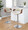 Curvo table in Walnut Wood, Cream Fabric, Chrome Metal, close-up detail, featuring swivel and adjustable height