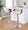 Curvo table in Walnut Wood, Cream Fabric, Chrome Metal, close-up detail, featuring swivel and adjustable height