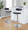 Demi Contemporary Adjustable Barstool with Swivel in Chrome Metal and Black Faux Leather with Rounded T Footrest- Set of 2 — lifestyle photo 2