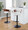 Elisa Mid-Century Modern Adjustable Barstool with Swivel in Black Metal, Walnut Wood and Cream Fabric with Rounded T Footrest- Set of 2 — lifestyle photo 1