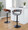 Elisa Mid-Century Modern Adjustable Barstool with Swivel in Black Metal, Walnut Wood and Grey Fabric with Rounded T Footrest- Set of 2 — lifestyle photo 1