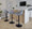 Fabrico Contemporary Adjustable Barstool with Swivel in Black Metal and Grey Noise Fabric with Rounded T Footrest- Set of 2 — lifestyle photo 2
