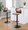 Folia table in Black Metal, Walnut Wood, Teal Fabric, featuring swivel and adjustable height