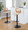 Folia Mid-Century Modern Adjustable Barstool with Swivel in Black Metal, Zebra Wood and Cream Faux Leather with Rounded T Footrest - Set of 2 — lifestyle photo 2