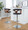 Gardenia table in Chrome Metal, Walnut Wood, Charcoal Fabric, featuring swivel and upholstered seat