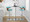 Gardenia table in Chrome Metal, Walnut Wood, Teal Fabric, close-up detail, featuring swivel and upholstered seat