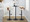 Gardenia Contemporary Adjustable Barstool with Swivel in Walnut Wood, Black Metal and Cream Faux Leather with Rounded T Footrest- Set of 2 — lifestyle photo 1