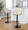 Gianna table in Black Metal, Walnut Wood, Cream PU, featuring swivel and upholstered seat