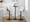 Gianna table in Black Metal, Walnut Wood, White PU, featuring swivel and upholstered seat