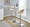 Grotto table in Chrome Metal, Whitewashed Wood, Oat Fabric, featuring swivel and adjustable height
