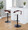 Grotto table in Black Metal, Mahogany Wood, White PU, featuring swivel and adjustable height